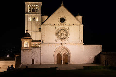 Assisi Basilica by night in Umbria region, Italy. The town is famous for the most important Italian St. Francis Basilica (Basilica di San Francesco)の写真素材