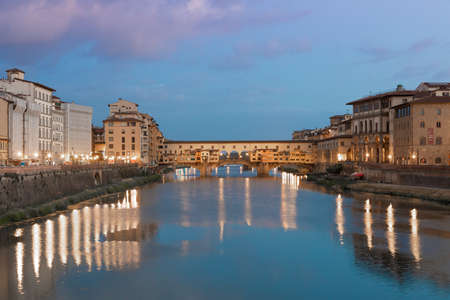 Florence, Italy - circa July 2021. Sunset light on Ponte Vecchio - Old Bridge.のeditorial素材