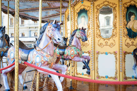 Florence, Italy - Circa March 2022: vintage carousel horse - antique attractionの写真素材