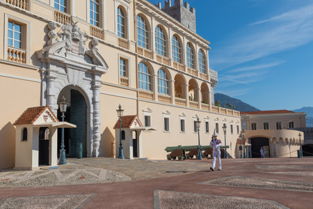 Monte Carlo - August 2022: guard with Summer uniform walking in front of the Royal Palaceのeditorial素材
