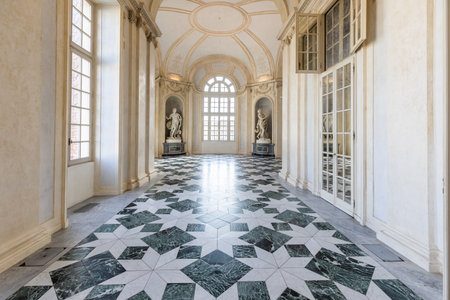 Venaria Reale, Italy - January 2023: luxury interior old royal palace. Gallery perspective with windowのeditorial素材