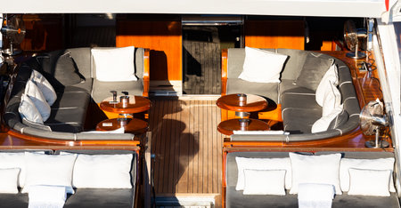 Luxury yachts. Comfortable expensive wooden design and furniture for holiday recreation tourism or travel and wealth conceptのeditorial素材