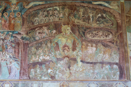 Pisa, Italy - 29 June 2023: Fresco in the Cemetery with Satan and the medieval hell, gothic design, 1464のeditorial素材