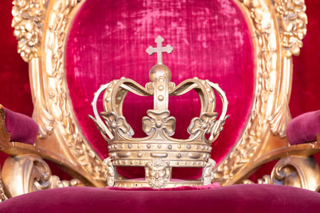Ancient crown on red velvet. Antique symbol of authority, luxury, monarchy, nobility, success