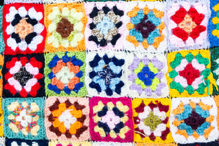 Multi colored blanket in wool, geometric background, retro decorative pattern