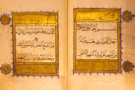 Turin, Italy - 22 August 2023. Oriental Art Museum. Section from Koran, Syria, 14th century, ink and gold on paperのeditorial素材