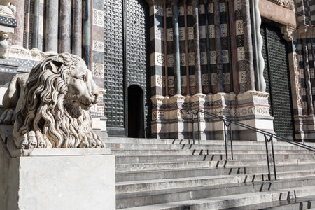Genoa, Italy - 28 December 2023: the guard lion at the entrance of the Duomo - most important church of the townのeditorial素材