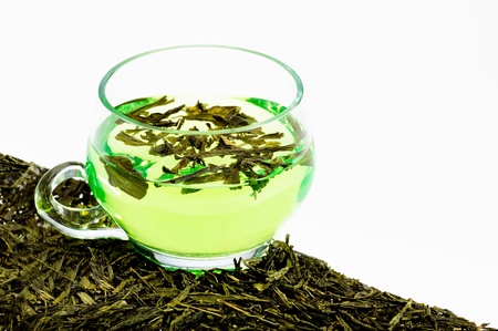 green tea cup and tea leafsの写真素材