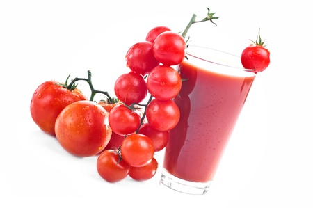 Tomato juice in a glass and cherry tomatoes  Isolated on white backgroundの写真素材