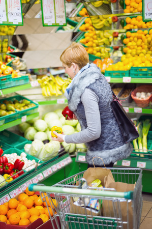 woman doing shopping in a supermarketの写真素材