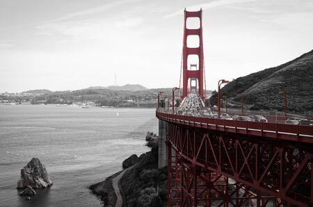 Film noir photo of rush hour traffic on the Golden Gate Bridge on a beautiful  afternoonの写真素材