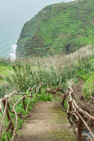 View of beautiful mountains and ocean on northern coast near Boaventura, Madeira island, Portugalの写真素材