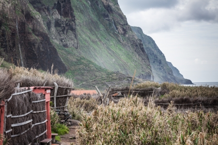 View of beautiful mountains and ocean on northern coast near Boaventura, Madeira island, Portugalの写真素材