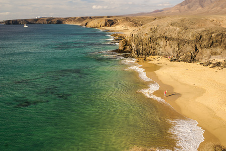 Lanzarote Papagayo turquoise beach and Ajaches in Canary Islandsの写真素材