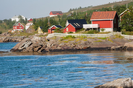 Red and yellow wooden fishing cabins in Norwayの写真素材