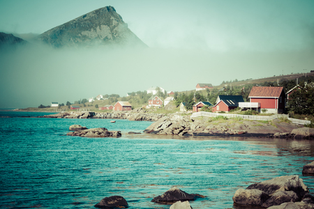 Red and yellow wooden fishing cabins in Norwayの写真素材