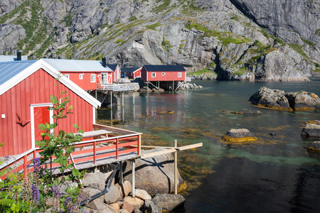 Red and yellow wooden fishing cabins in Norwayの写真素材