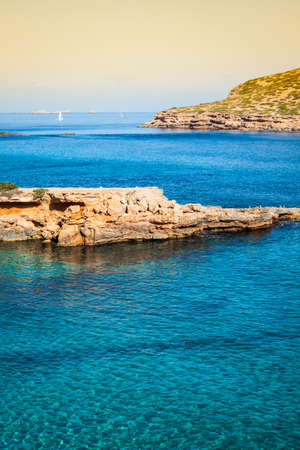 beautiful island and turquoise waters in Cala Conta, Ibiza Spainの写真素材