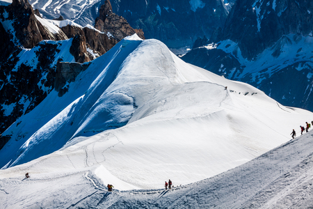 Mont Blanc, Chamonix, French Alps. France. - tourists climbing up the mountainの写真素材