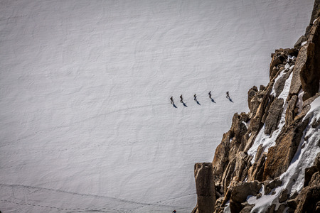 Mont Blanc, Chamonix, French Alps. France. - tourists climbing up the mountainの写真素材