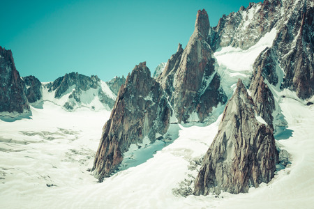 Massif de mont Blanc on the border of France and Italy. In the foreground the ice field and crevasses of the Valley Blancheの写真素材