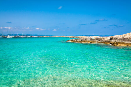 Tourists in Illetes beach Formentera island, Mediterranean sea, Spainの写真素材