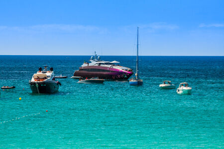 Luxury yachts in turquoise beach of Formentera Illetesの写真素材