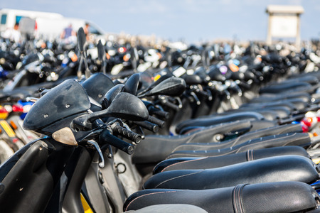 Row of scooters on the parking,formentera,spainの写真素材