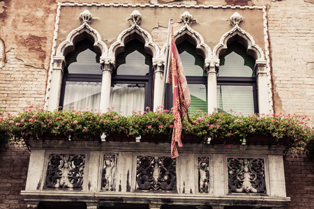 Facades of house on a street in Venice, Italyの写真素材