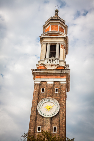 The bell tower of the Church Saint Apostoli in Venice, Italyの写真素材