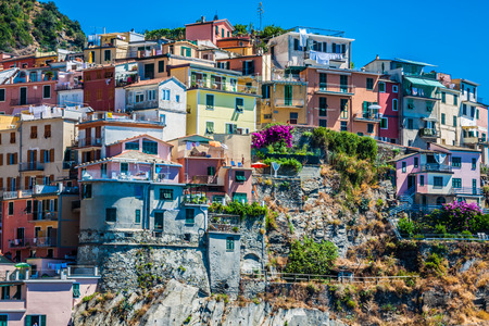 Village of Manarola with ferry, Cinque Terre, Italyの写真素材