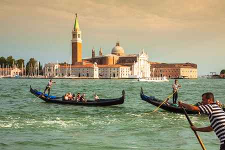 Venice, Italy,August 9, 2013:Traditional Gondola on Canal Grande with San Giorgio Maggiore church in the background at sunset, San Marco, Venice, Italyのeditorial素材