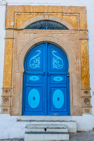Typical local door of traditional home; Tunis; Tunisiaの写真素材