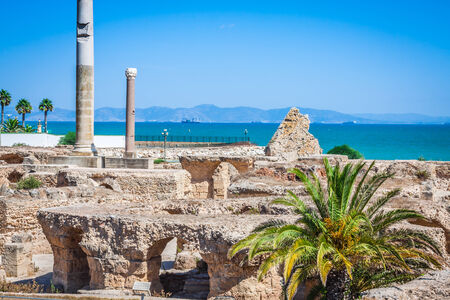 Ancient ruins at Carthage, Tunisia with the Mediterranean Sea in the backgroundの写真素材