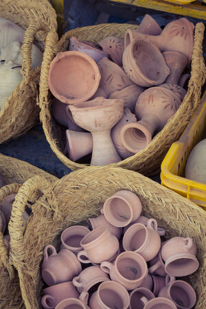 Rustic handmade ceramic clay brown terracotta cups souvenirs at street handicraft market in gafsa,Tunisiaのeditorial素材