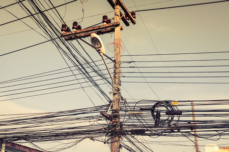 bunch of electrics and communication wires in Phuket street, Thailandの写真素材