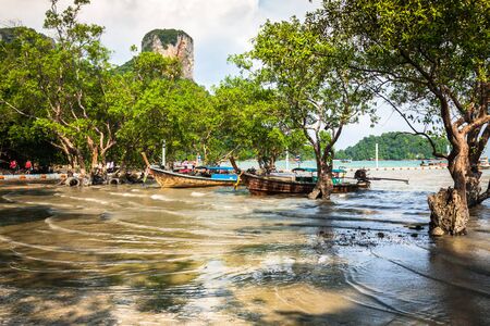 Traditional Thai boat, Long tail stand in the sea at Railay beach, Krabi, Thailandの写真素材