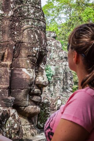 Faces of ancient Bayon Temple At Angkor Wat, Siem Reap, Cambodiaの写真素材
