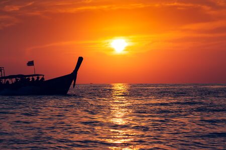 Fishing boat with sunset in phi phi islands,Thailand