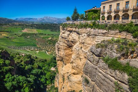 view of buildings over cliff in ronda, spainの写真素材