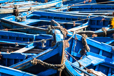 Lots of blue fishing boats in the port of Essaouira, Moroccoの写真素材