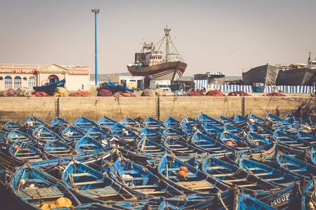 ESSAOUIRA, MOROCCO - MAY 4, 2013: blue fishing boats in the port of Essaouira