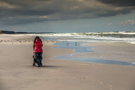 Women Walking along the beach.の写真素材