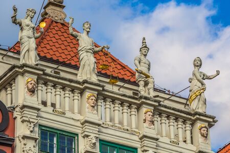 Statue of justice with scales and a sword in the historic center of Gdansk.の写真素材