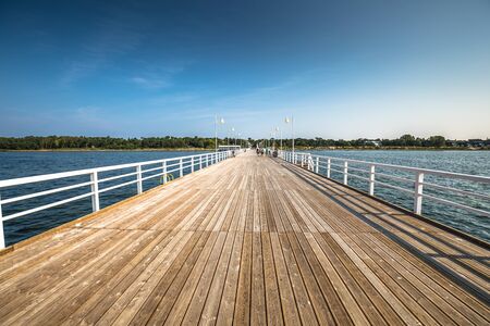 Wooden pier in Jurata town on coast of Baltic Sea, Hel peninsula, Polandの写真素材