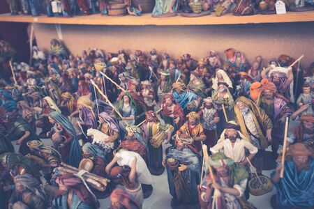 Decorative figurine on stall with decorations for winter holidaysの写真素材