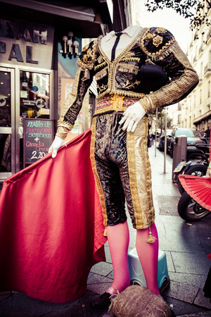 Beautiful traditional red flamenco dress hanged for display in a shop Spainのeditorial素材