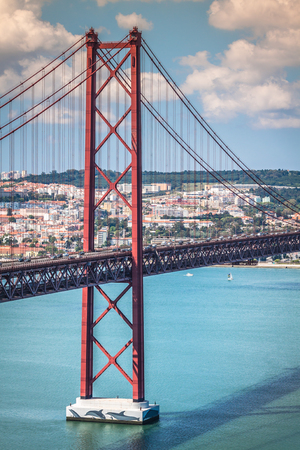 The 25 de Abril Bridge is a bridge connecting the city of Lisbon to the municipality of Almada on...