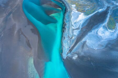 Aerial drone view of a huge riverbed and delta, glacial river system transporting deposits from the...