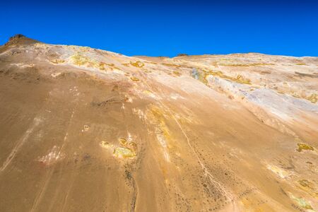 Namafjall Hverir geothermal area in Iceland. Stunning landscape of sulfur valley with smoking...